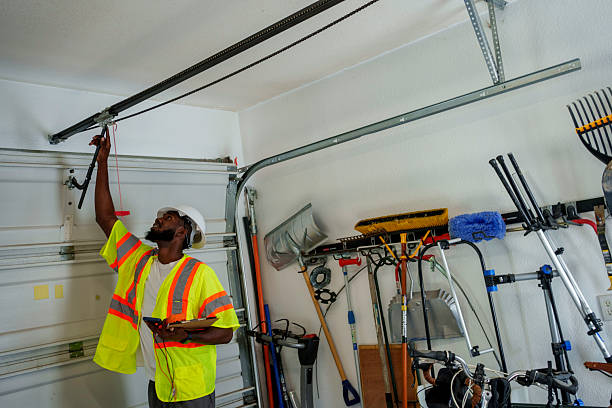 Professional Garage Door Panel Replacement technician working in Lowndes County County, MS